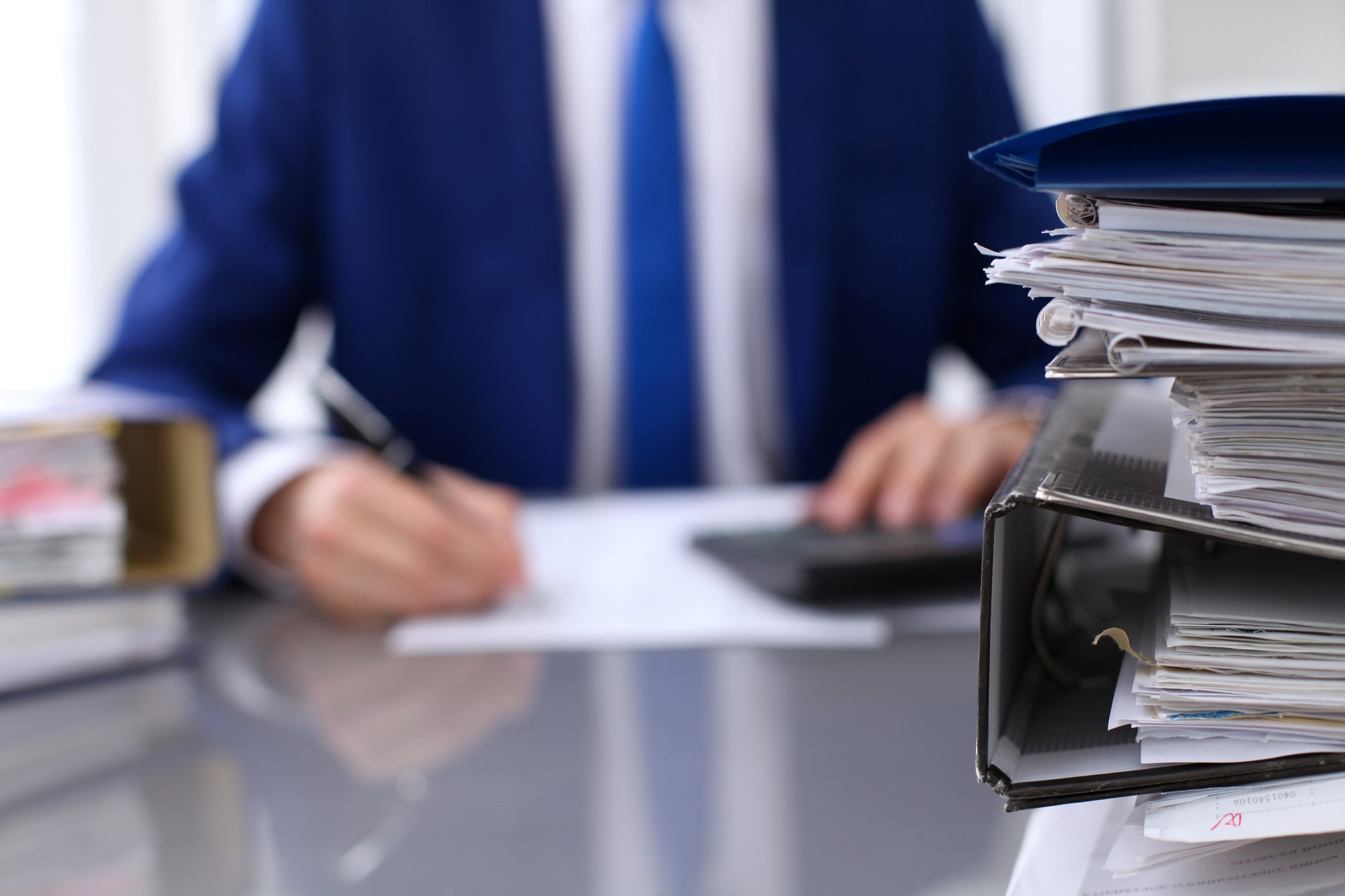 Binders With Man Working At The Background