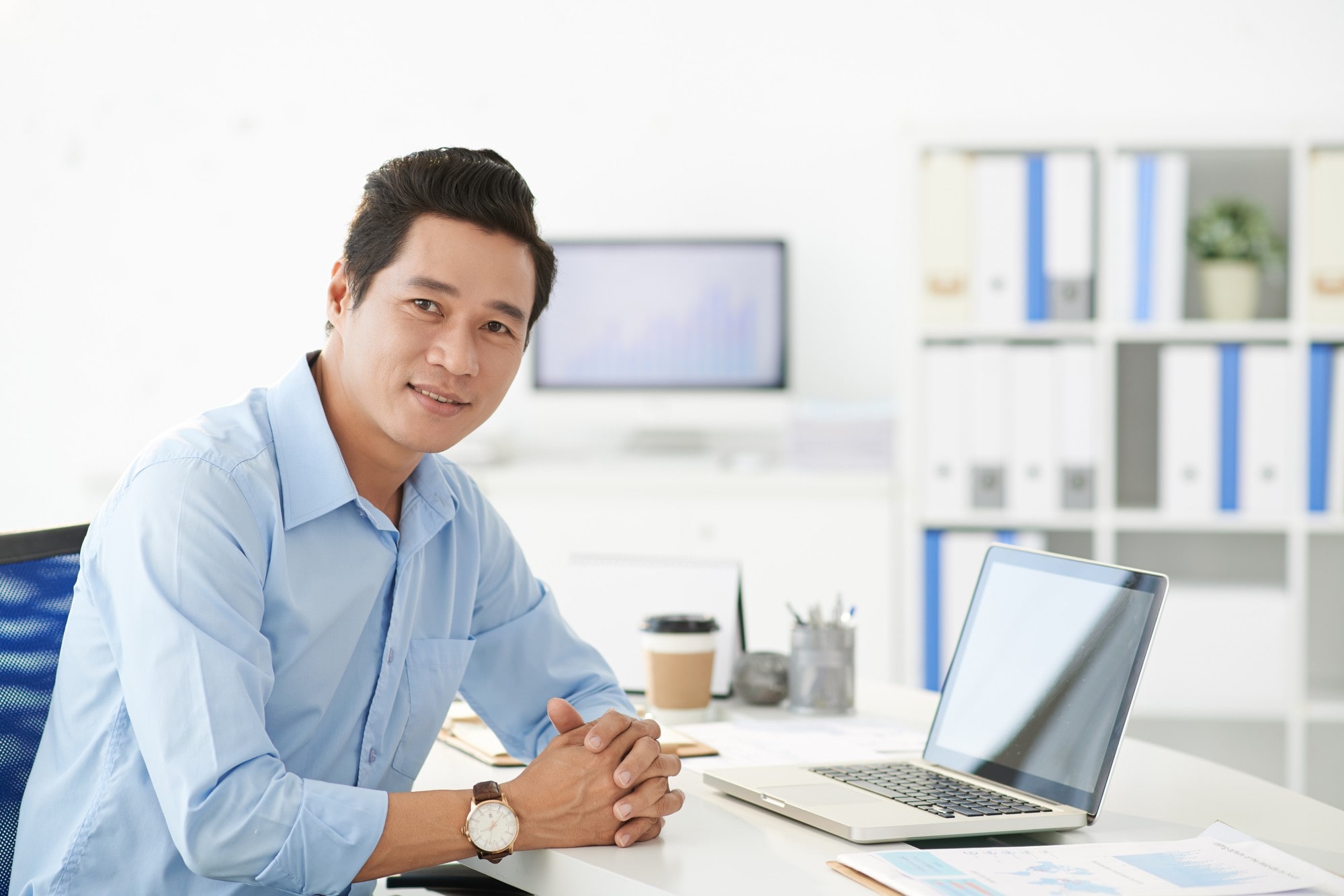 Man With Laptop On Desk